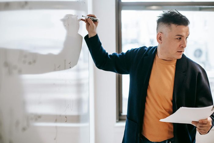 Professor teaching at class. Photo: Vanessa Garcia, Pexels